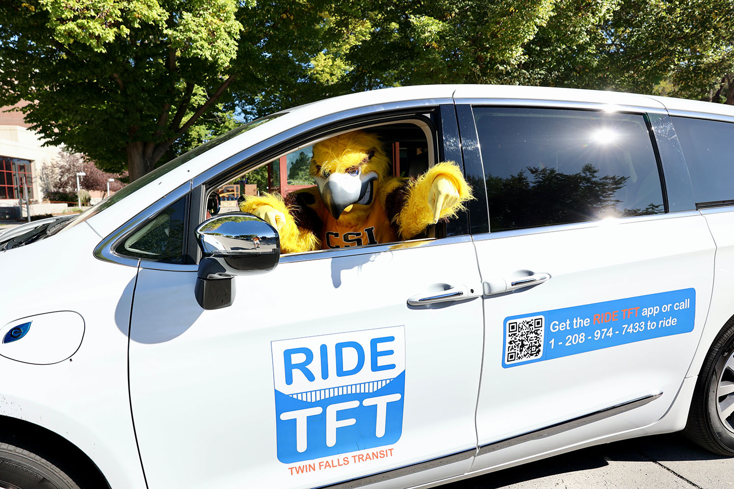 CSI's Eagle mascot, Gilbert, in the drivers seat of a Ride TFT van