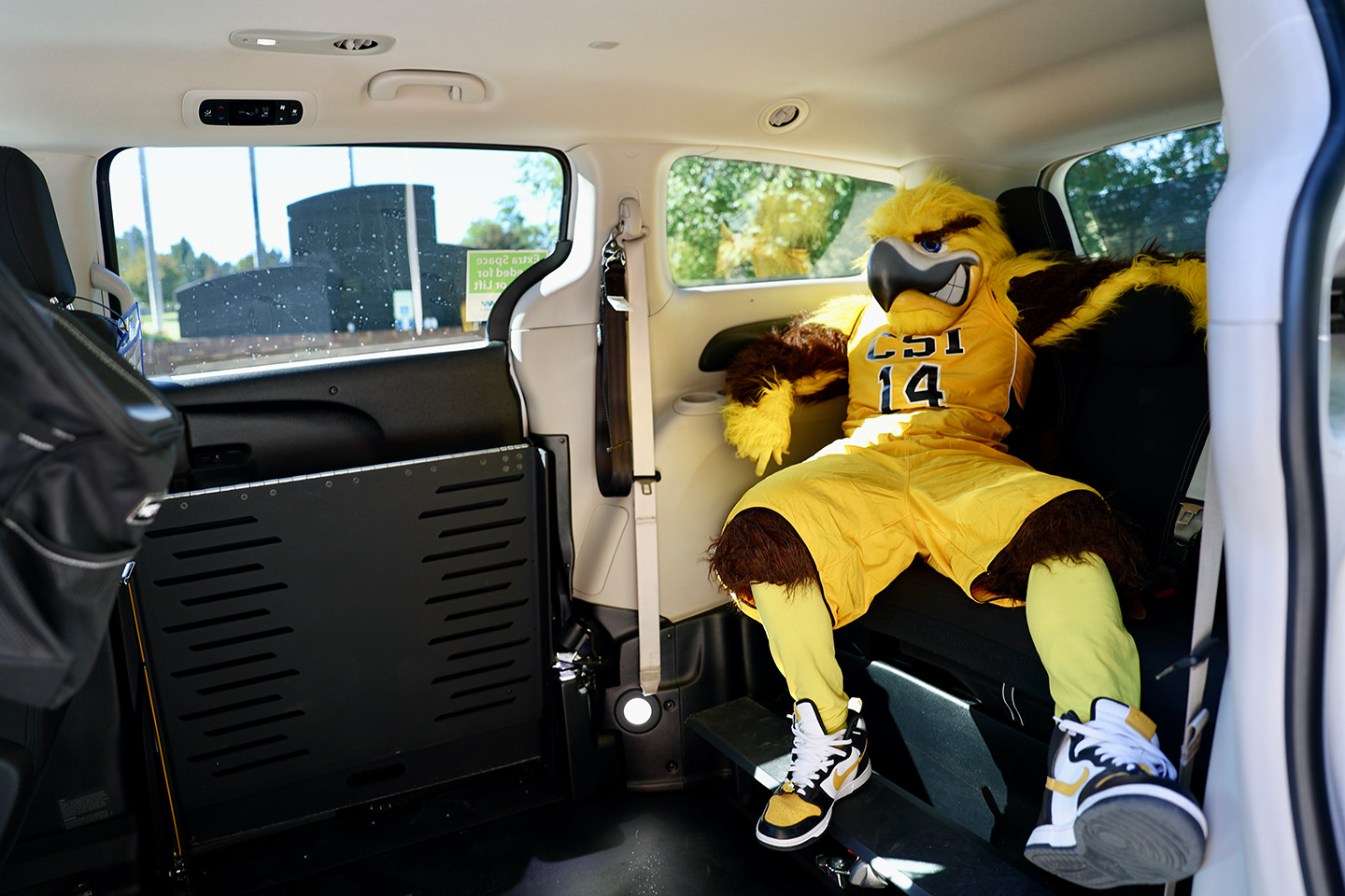 The CSI Eagle mascot, Gilbert, sitting inside an ADA compliant Ride TFT van!